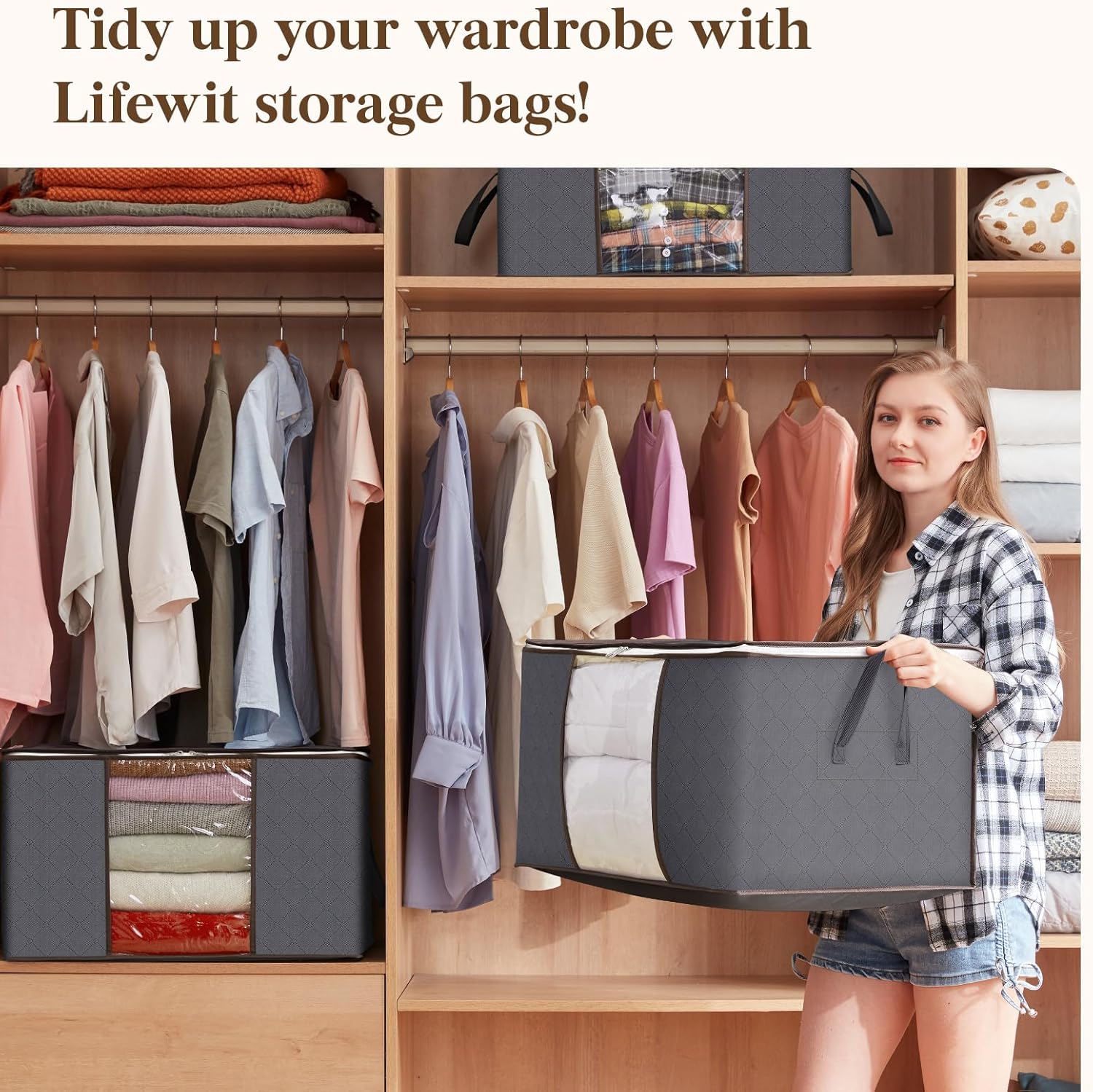 Woman holding a large Boxora storage bag in front of an organised wooden wardrobe